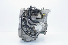 Load image into Gallery viewer, Mechanical engine component on a metal surface with a white background